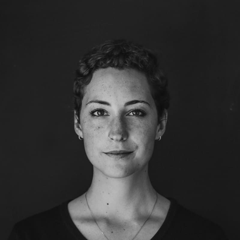 A calm black and white portrait of a woman