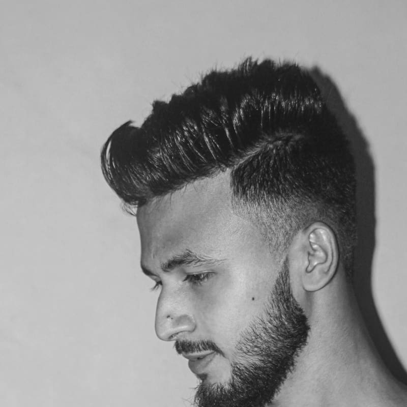 Black and white portrait of a man with neatly styled hair
