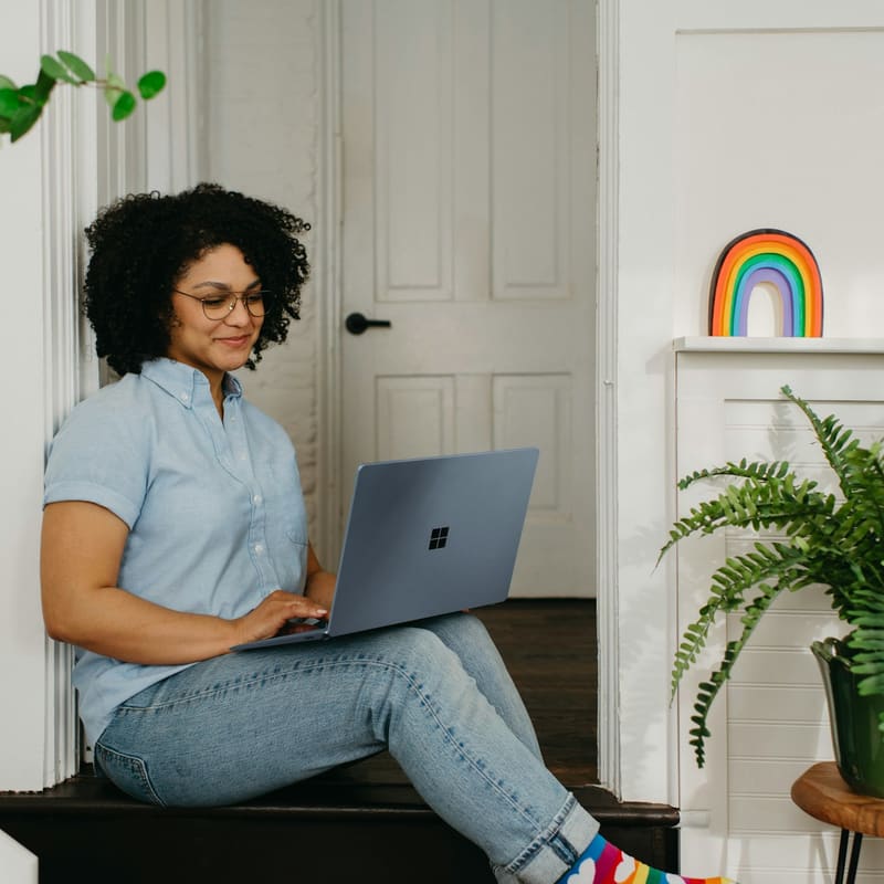 A woman at home using a laptop